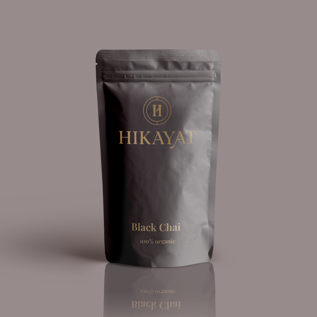 Hikayat Black Chai packaging on a gray background